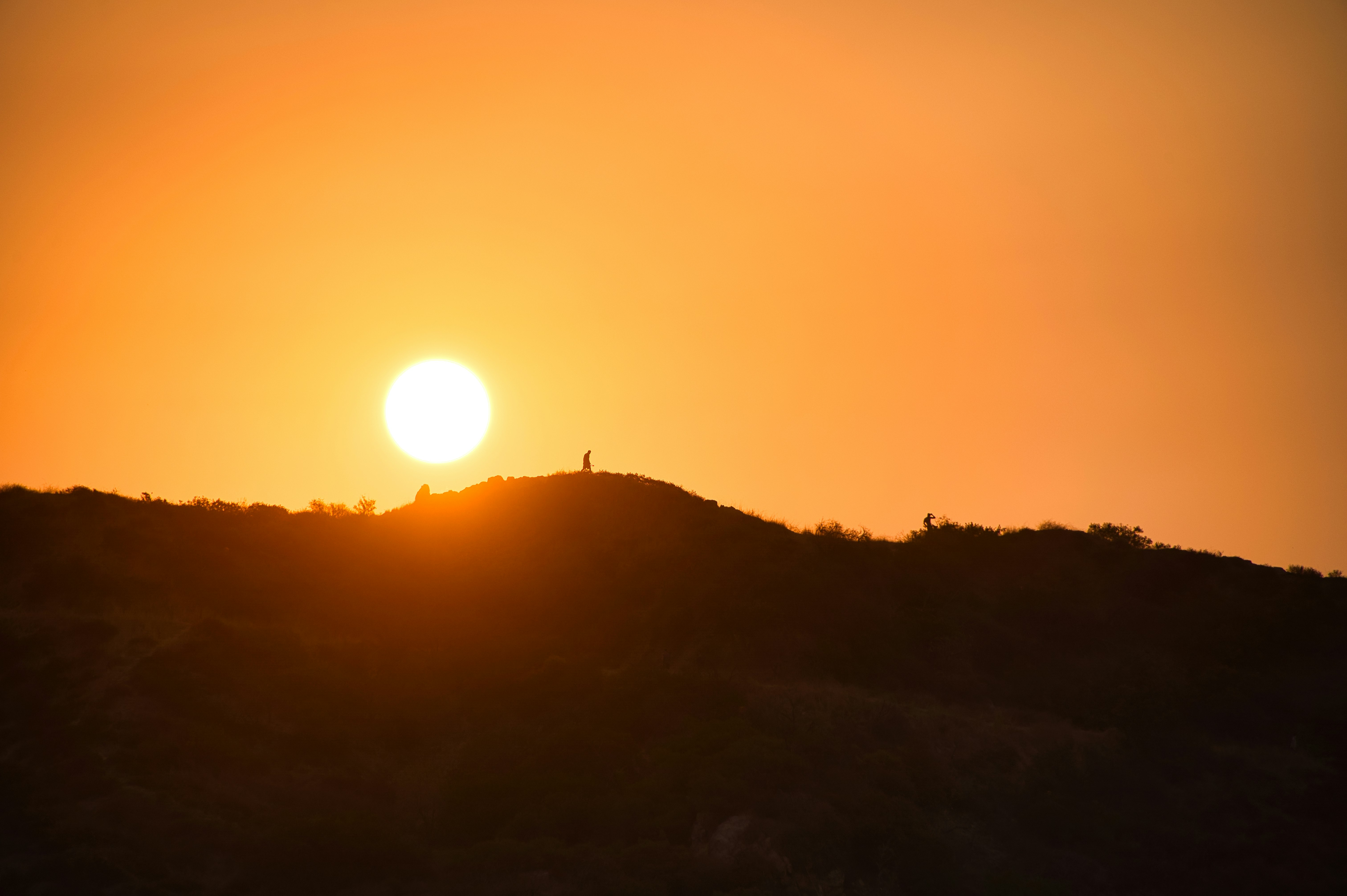 silhouette of mountain during sunset